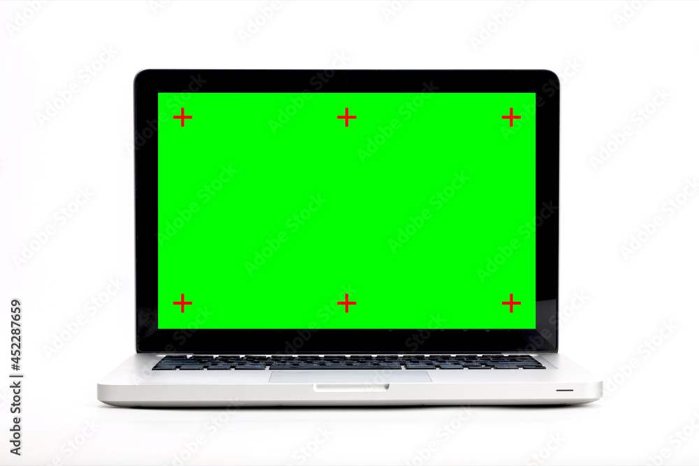 Aufkleber laptop computer with empty green screen isolated on white background