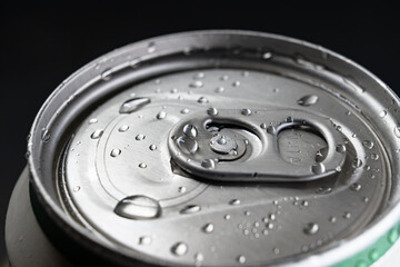 closed aluminum can of drink. close-up. bar.