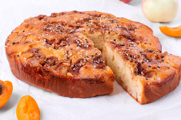 Apple and apricot pie topped with sesame seeds