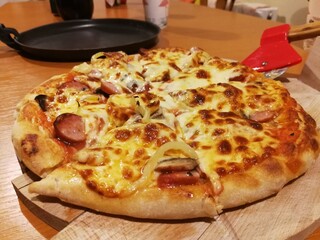 Homemade oven pizza on wooden board