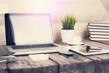 PC laptop, tablet and phone on wooden table