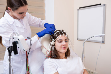 Patient brain testing using encephalography at medical center