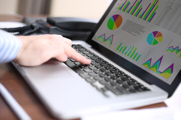 Business man checking stock diagram in office