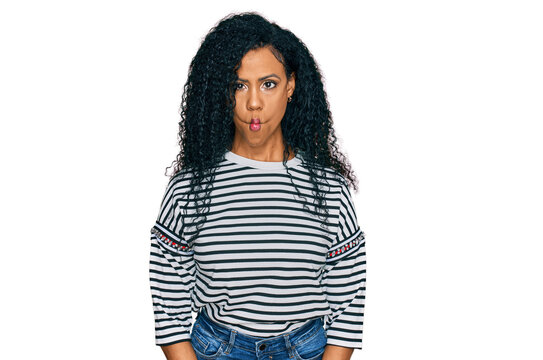 Middle age african american woman wearing casual clothes making fish face with lips, crazy and comical gesture. funny expression.