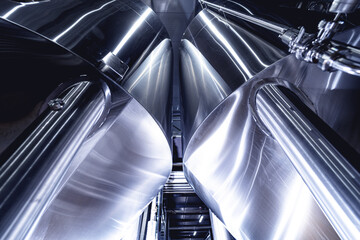 Rows of steel tanks for beer fermentation and maturation in a craft brewery