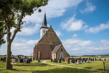 Texel, the Netherlands. August 2021. The old church with cemetery In Den Hoorn at Texel, Holland.