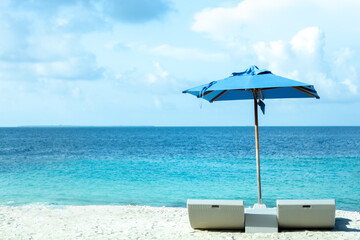 Maldive luxury beach chairs with clear sea water