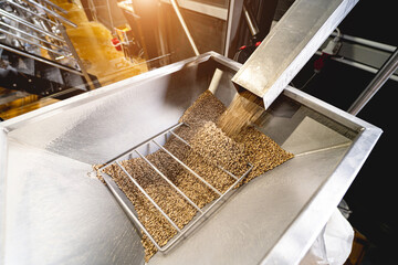 The technological process of grinding malt seeds at the mill