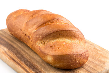 Bread loaf on a wooden chopping board