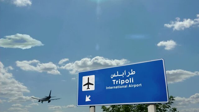 Jet airplane landing in Tripoli, Libya. City arrival with airport direction sign. Travel, business, tourism and transport concept.