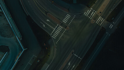 Aerial view of a junction with road markings at night. Bridges, roads, or Streets in transportation concept. Structure shapes of architecture