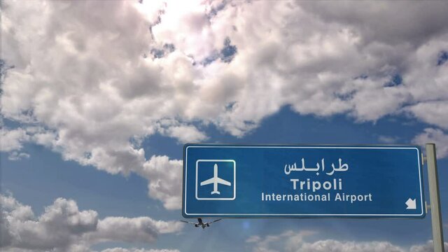 Jet plane landing in Tripoli, Libya. City arrival with airport direction sign. Travel, business, tourism and transport concept.