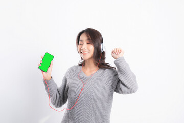 Woman is listening to music.