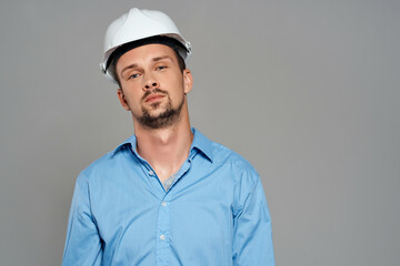man in working uniform white construction helmet safety professional