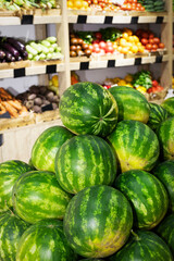 Fruit market with a variety of colorful fresh fruits and vegetables