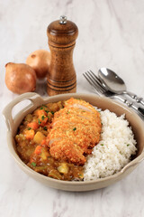 Fried Pork, Beef, or Chicken Cutlet Curry with Rice - Japanese Food Style. Served on Ceramic Plate White Background