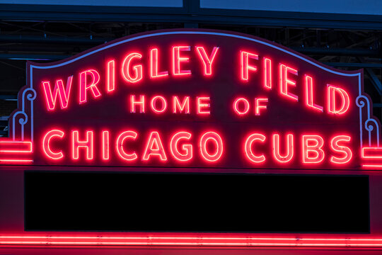 Wrigley Field Home of Chicago Cubs Marquee in red neon lights with copy space. Wrigley Field has been home to the Cubs since 1916.