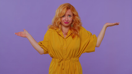 What why. Sincere redhead lovely girl raising hands in indignant expression, asking reason of...