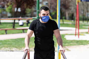 Young Sportsman Working Out In A Park