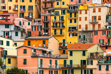 Fototapeta na wymiar colorful house, buildings and old facade with windows in small picturesque village Manarola Cinque terre in liguria