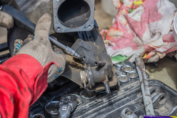Dismantling an old car engine close-up