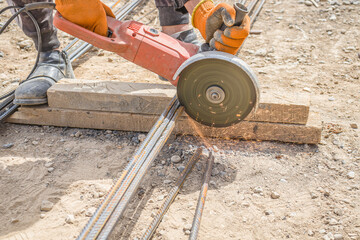 Cutting reinforcement with a hand-held electric tool at a construction site