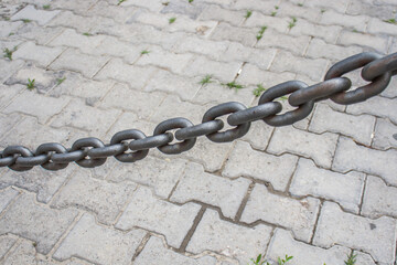 Heavy metal chain as a fence close-up
