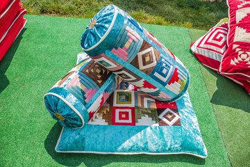 Asian national bedding. Velvet pillows and bolsters.