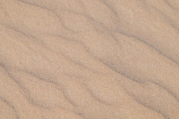 Fototapeta na wymiar River sand close-up as background.