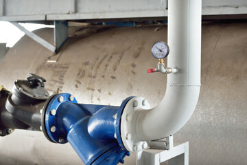 Industrial water treatment and boiler room. Pipes, piping, levers, barometers, connections....