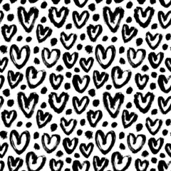 Vector pattern with black hearts and dots. Black-white seamless pattern for Valentine's Day. Hand-drawn charcoal hearts. Romantic and funny ink illustration. Simple repeating chaotic texture.