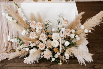 Art decor wedding decoration close up. Beautiful wedding background. Flowers in an antique vase. Elegant natural flowers