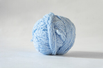 Side view of a blue thread ball