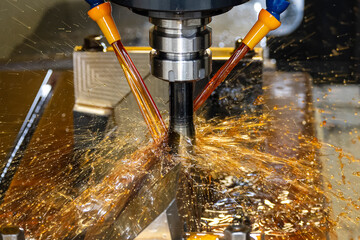 The CNC milling machine cutting the  mold parts with oil coolant method.