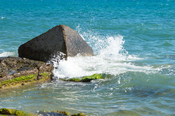 Sea view. Panorama of the sea and sky. Concrete sea fortification. Breakwaters