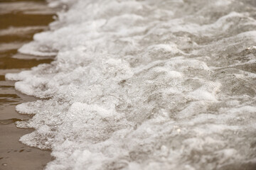 Close up of waves on the shore of a beach