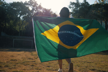 Black woman with Brazilian flag, independence day