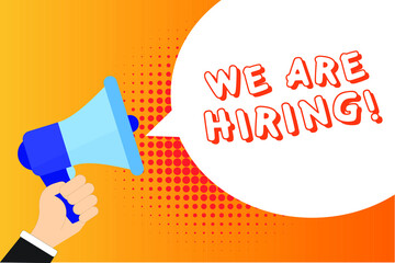 Male hand holding megaphone with We are Hiring! speech bubble. Loudspeaker. Banner for business, marketing and advertising. Vector illustration.