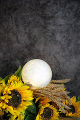 dark background with moon lamp, wheat ears and sunflowers. Esoteric spiritual ritual for full...