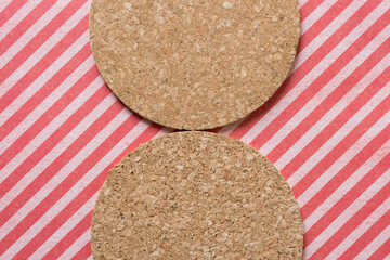 cork texture on striped paper background