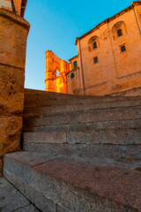 Vertical view of the exterior side of the old religious cathedral of Cuenca at sunset, World Heritage City, Spain.