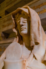 Detail view of sculptures carved in marble stone in the interior chapels of the old religious cathedral of Cuenca at sunset, World Heritage City, Spain.