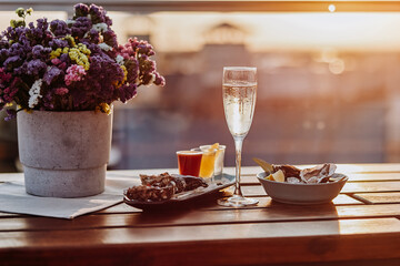 Fresh open oysters with a glass of chilled prosecco wine and set of shoot alcoholic cocktails served on table. Seafood delicios