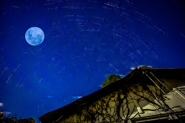 Star trails in a Sydney backyard with a blue moon NSW Australia