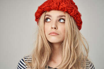 blonde woman with red caps cosmetics fashion glamor light background