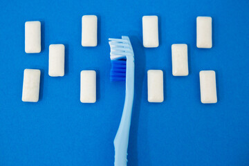 Blue toothbrushes on a blue background. Protecting teeth from caries. 