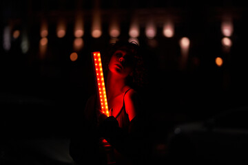 Night portrait in the light of a red lantern