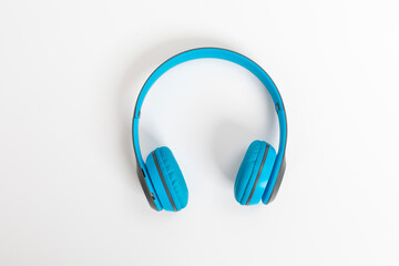 Blue wireless headphone isolated on white background.
