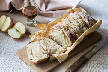 Apple cinnamon dessert bread cake on wooden board, selective focus