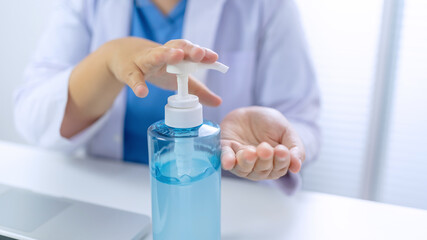 Obraz na płótnie Canvas Medicine doctor using hand sanitizer gel. protection and prevention Coronavirus global pandemic outbreak